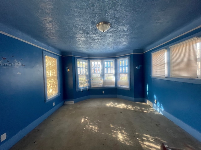 15340 Stout St, Detroit, MI 48223 - empty room featuring baseboards and a textured ceiling