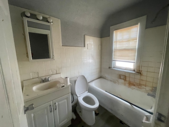 15340 Stout St, Detroit, MI 48223 - bathroom with a bathtub, vanity, toilet, and tile walls