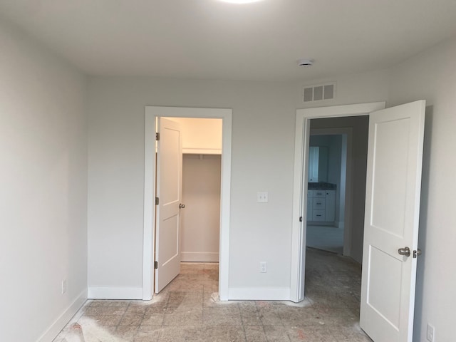 32627 Adam Brown Dr, Rockwood, MI 48173 - unfurnished bedroom with a spacious closet and baseboards