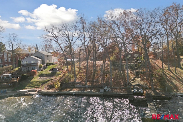 view of front of home with a water view