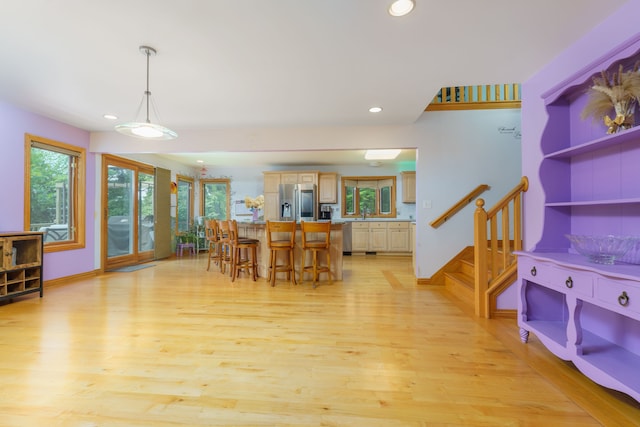 dining space with light wood-type flooring