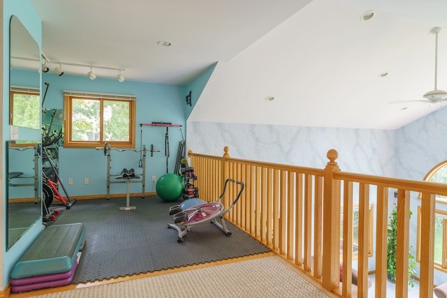 workout room featuring track lighting