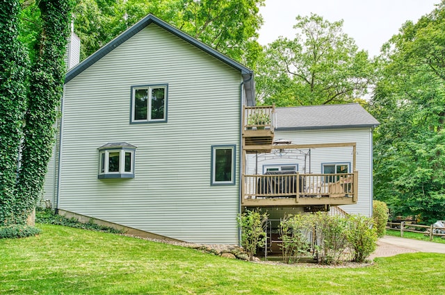 view of property exterior featuring a lawn