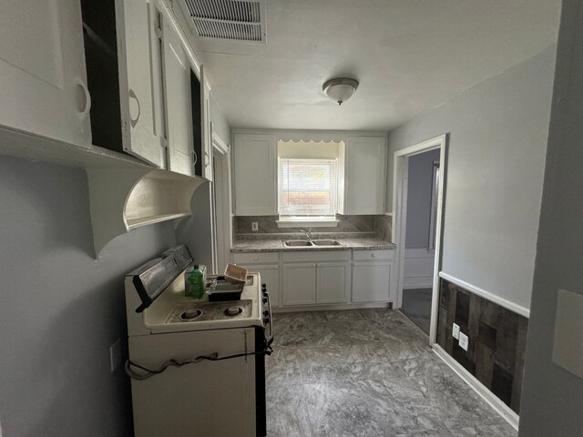 10420 Lakepointe St, Detroit, MI 48224 - kitchen with a sink, white range with gas cooktop, white cabinetry, and light countertops