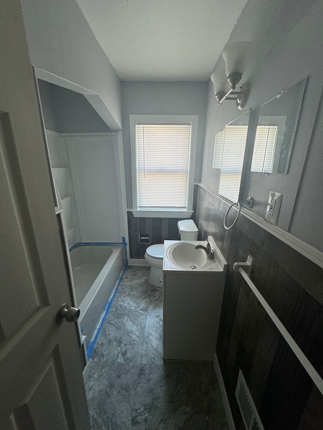 full bathroom featuring vanity, toilet, and shower / tub combination