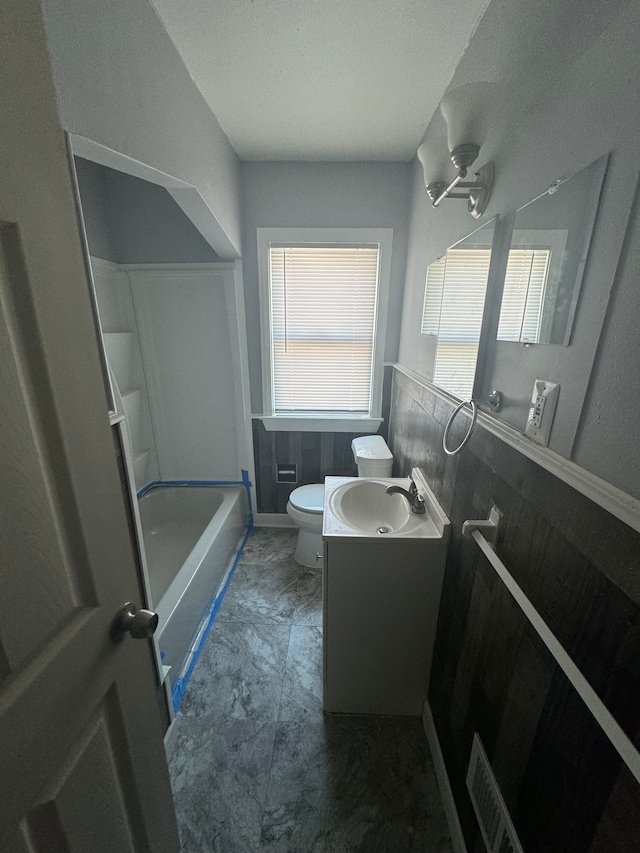 10420 Lakepointe St, Detroit, MI 48224 - bathroom featuring vanity, toilet, and shower / washtub combination