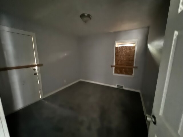 10420 Lakepointe St, Detroit, MI 48224 - unfurnished room featuring dark carpet and baseboards