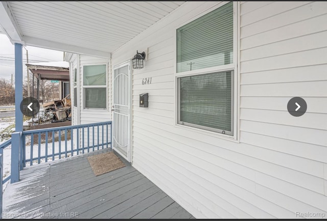 wooden terrace with a porch