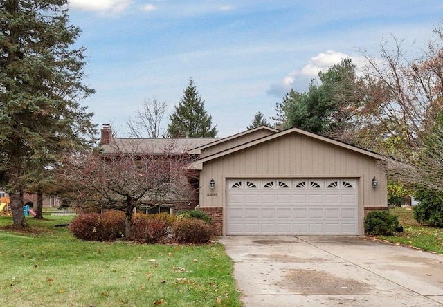 ranch-style house with a garage and a front yard