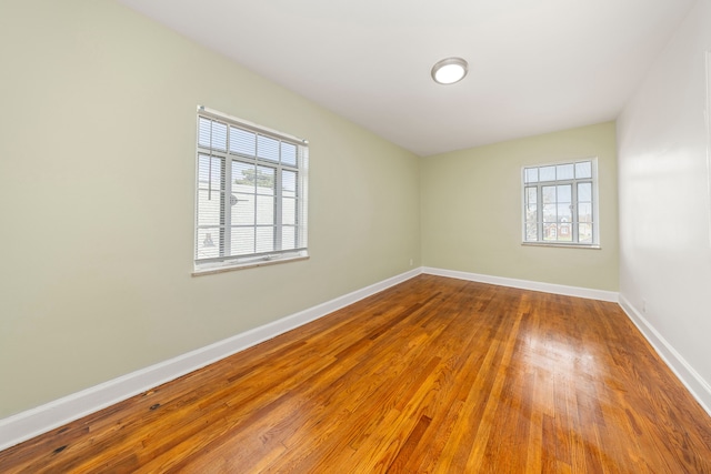 empty room featuring hardwood / wood-style flooring