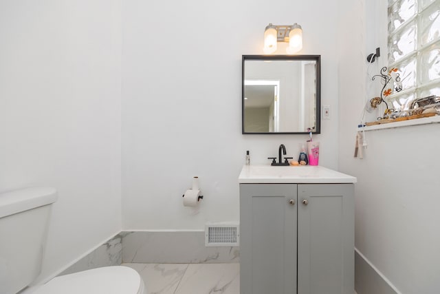 bathroom with vanity and toilet