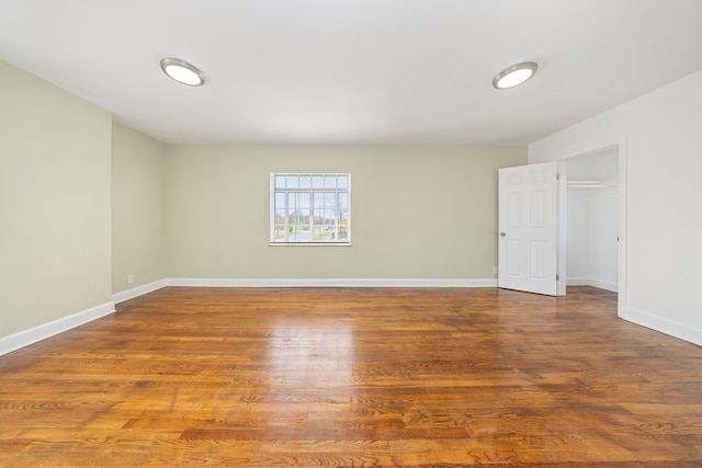 spare room featuring hardwood / wood-style flooring