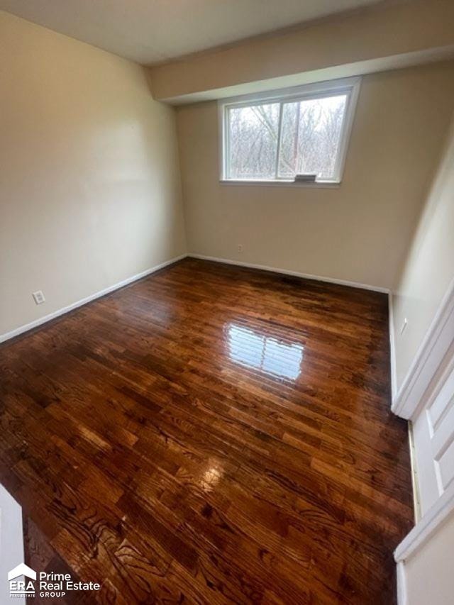 empty room featuring dark hardwood / wood-style floors