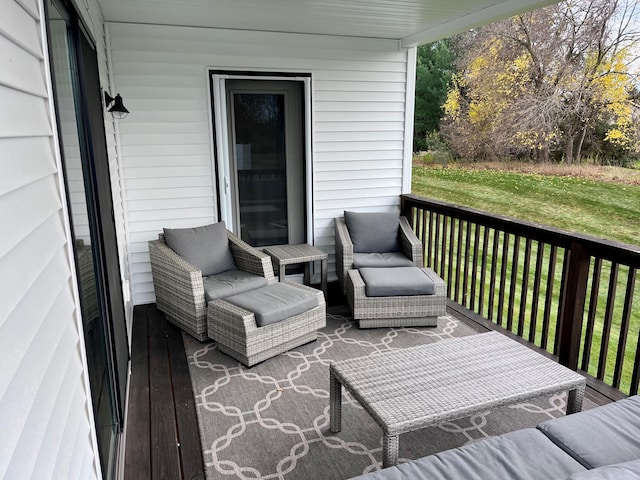 wooden deck featuring a lawn