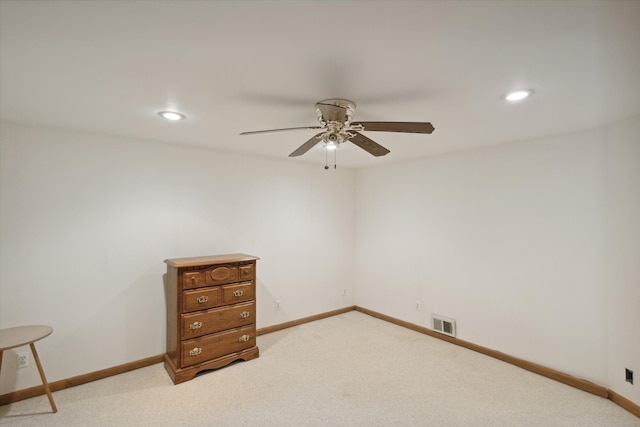 unfurnished room featuring ceiling fan and light colored carpet