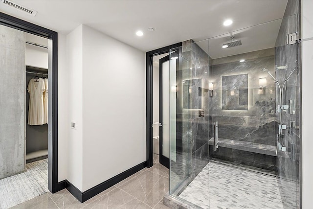 bathroom with tile patterned flooring and a shower with shower door