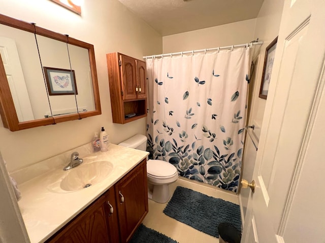 bathroom featuring toilet, vanity, and a shower with shower curtain