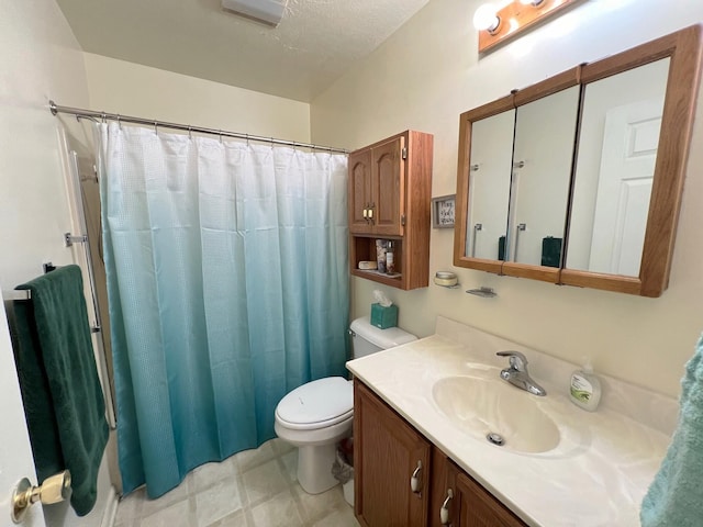 bathroom with walk in shower, vanity, and toilet