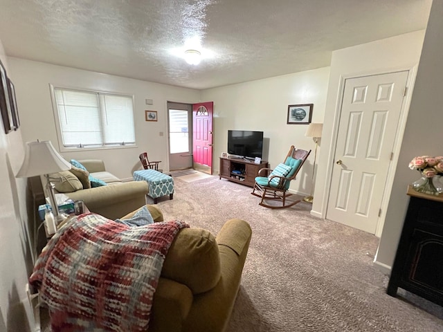 living room with carpet floors and a textured ceiling