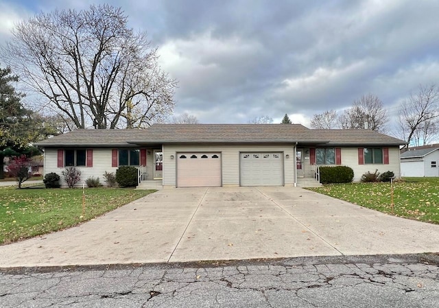 single story home featuring a front lawn and a garage