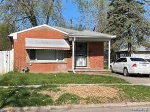 bungalow with a front yard