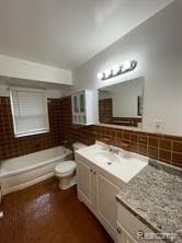 full bathroom featuring vanity, toilet, and shower / bathtub combination