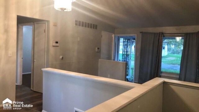 6223 Cypress Dr, Mount Morris, MI 48458 - hall with dark wood-style flooring and vaulted ceiling