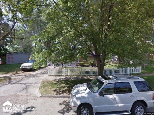 6223 Cypress Dr, Mount Morris, MI 48458 - view of property hidden behind natural elements featuring a fenced front yard
