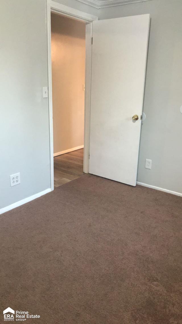 6223 Cypress Dr, Mount Morris, MI 48458 - carpeted empty room featuring baseboards