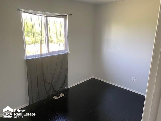 empty room featuring hardwood / wood-style floors