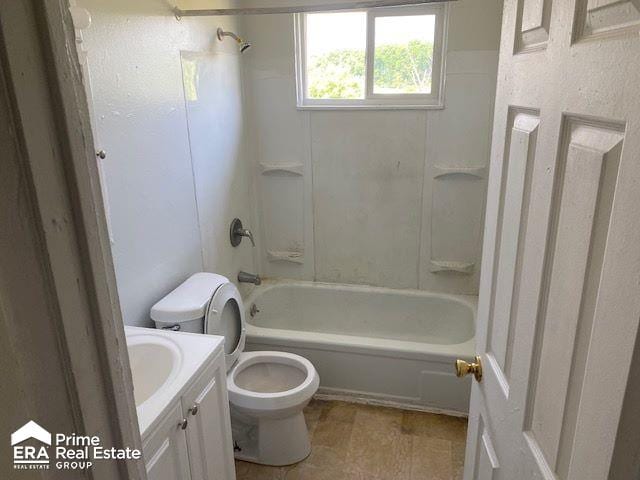 full bathroom with vanity,  shower combination, and toilet