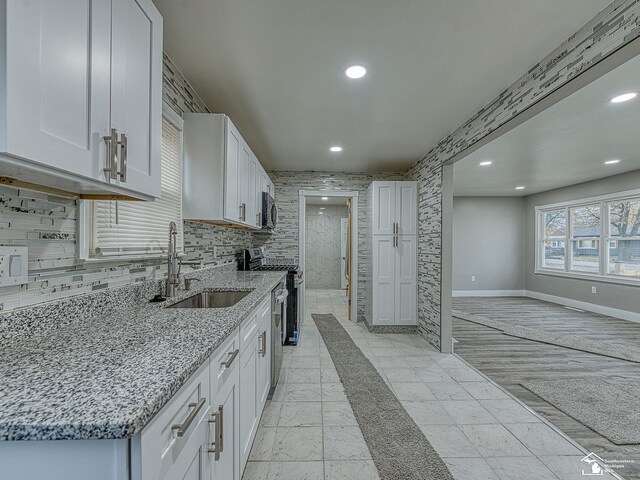 3495 Vermont Ct, Monroe, MI 48161 - kitchen featuring stainless steel appliances, a sink, recessed lighting, light stone countertops, and white cabinets