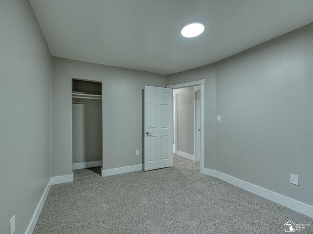 3495 Vermont Ct, Monroe, MI 48161 - unfurnished bedroom with carpet floors, a closet, and baseboards