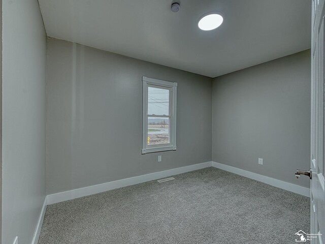 3495 Vermont Ct, Monroe, MI 48161 - unfurnished room featuring a smoke detector, carpet floors, and baseboards