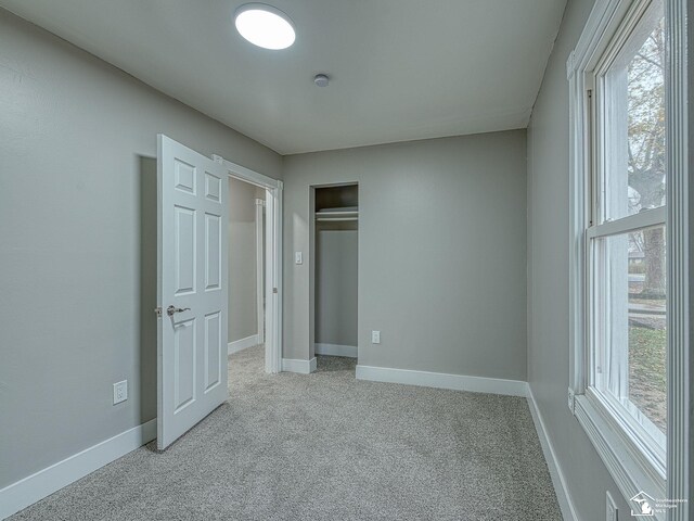3495 Vermont Ct, Monroe, MI 48161 - unfurnished bedroom featuring light colored carpet and baseboards