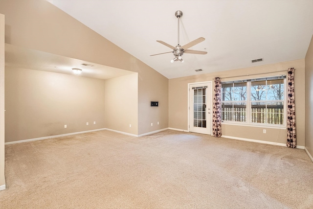 carpeted empty room with ceiling fan and vaulted ceiling