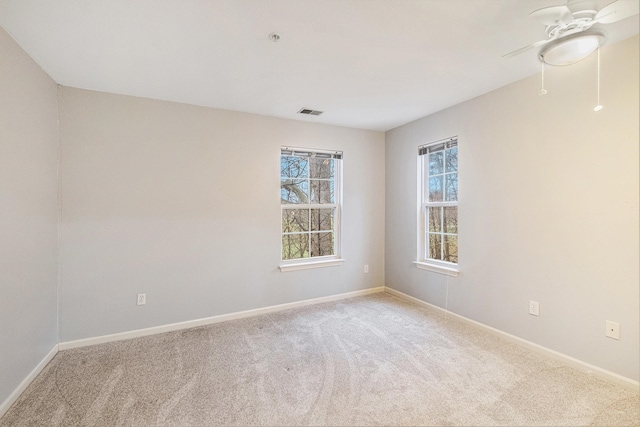 empty room with light carpet and ceiling fan