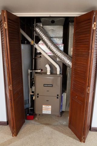 utility room featuring water heater