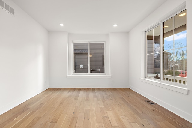 unfurnished room featuring light wood-type flooring