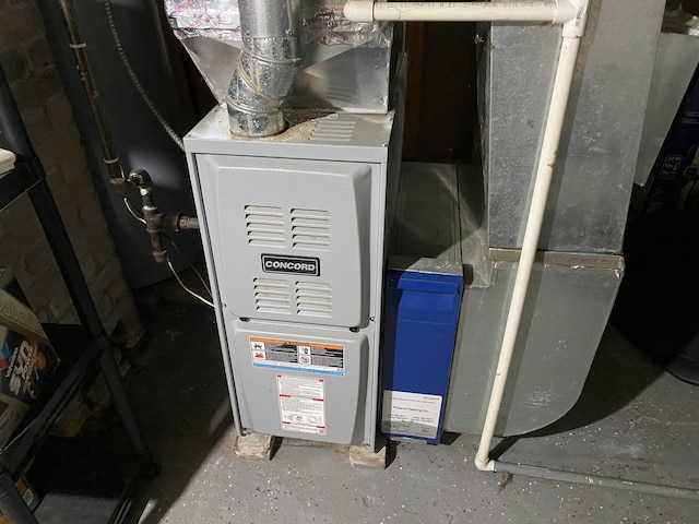 2298 S Term St, Burton, MI 48519 - utility room with heating unit