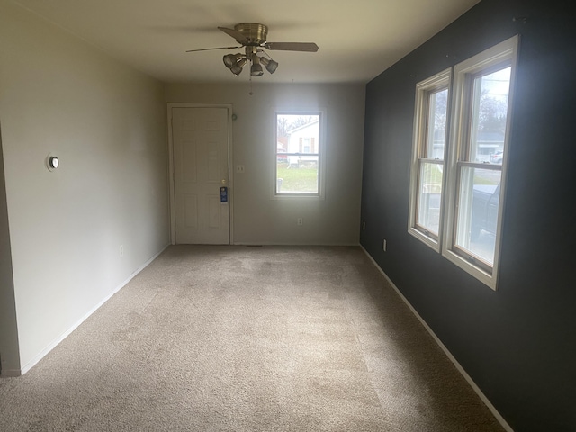 2298 S Term St, Burton, MI 48519 - empty room with a ceiling fan, light carpet, and baseboards