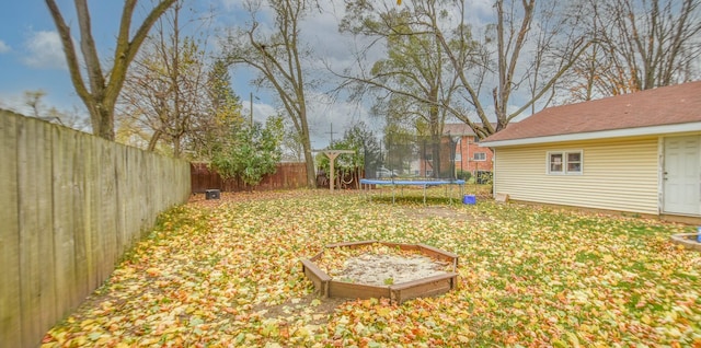 view of yard with a trampoline