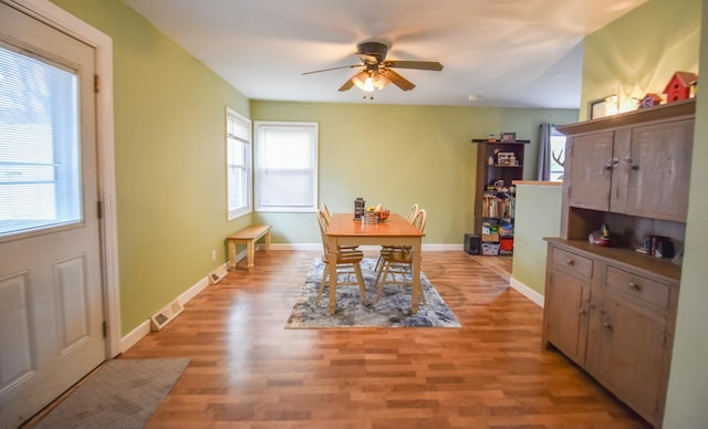 dining area featuring ceiling fan and light hardwood / wood-style floors