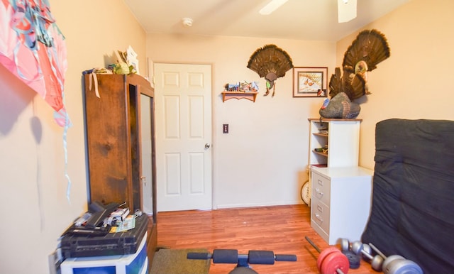 bedroom with ceiling fan and light hardwood / wood-style floors