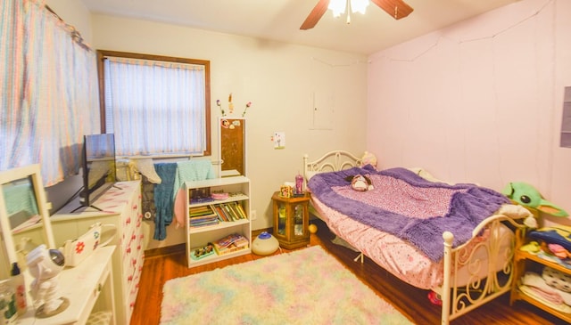 bedroom featuring ceiling fan and hardwood / wood-style floors