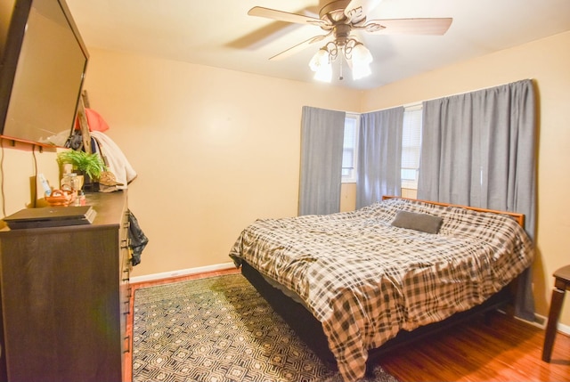 bedroom with hardwood / wood-style flooring and ceiling fan