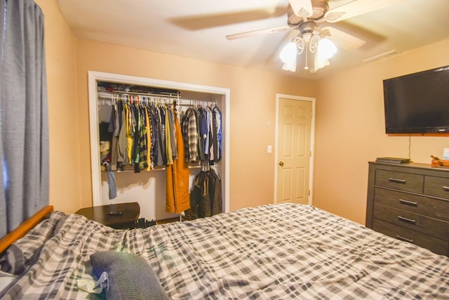 bedroom with ceiling fan and a closet