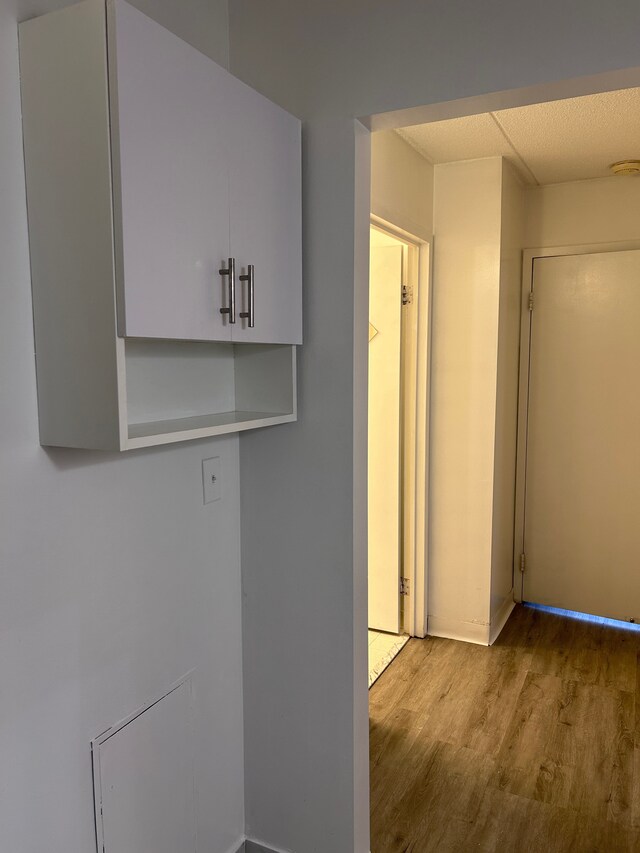 21800 Morley Ave Unit 101, Dearborn, MI 48124 - laundry room featuring wood finished floors and baseboards
