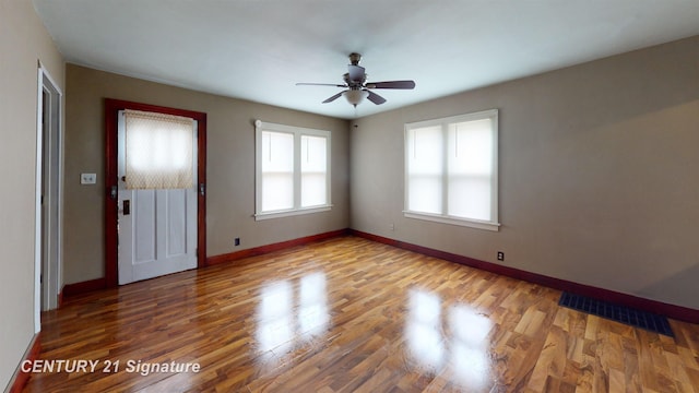 unfurnished room featuring ceiling fan and hardwood / wood-style floors