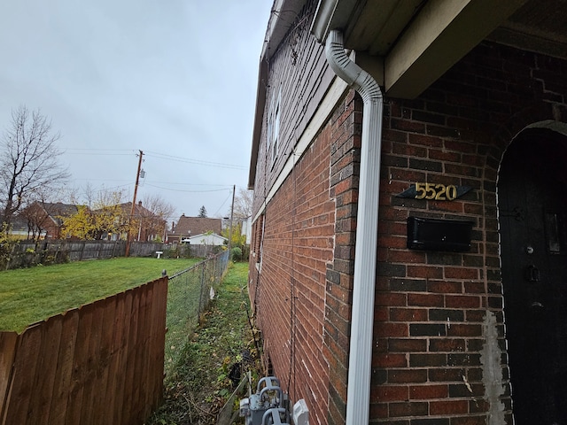 view of side of property featuring a yard